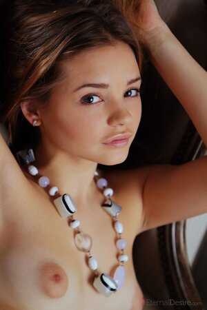 Mesmerizing young hottie willingly demonstrates her naked curves for the camera