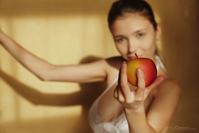 Young sweetheart enjoys eating fruit and reveals big boobs when stripping naked