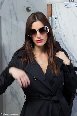 Slutty smoking cougar comes to the men's toilet to pose half-naked there