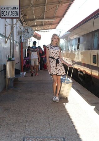 Charming blonde sweetie in dress flashes panties on the railway station