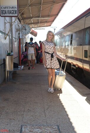 Charming blonde sweetie in dress flashes panties on the railway station