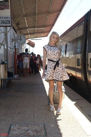 Charming blonde sweetie in dress flashes panties on the railway station
