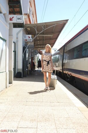 Charming blonde sweetie in dress flashes panties on the railway station