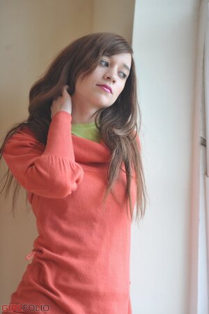 Sensitive brunette girl enjoys herself while revealing underwear by the window