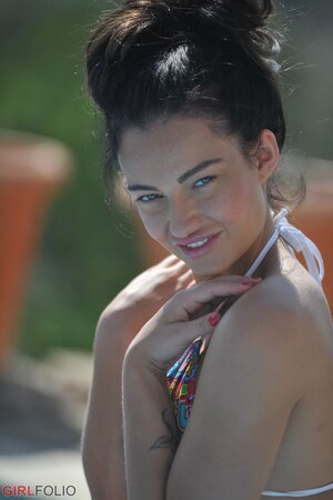 Horny teen peels swimwear to display her small perky tits and coochie