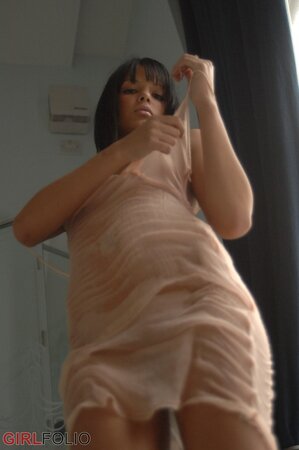 Desirable black-haired sexpot undresses to take shower after the party