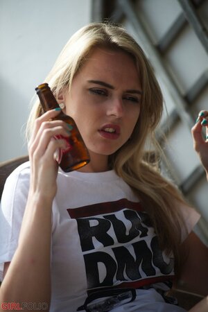 Bad girl loves smoking cigarettes and drinking beer while being totally naked