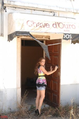 Playful bimbo agrees to reveal her perky assets in the abandoned café