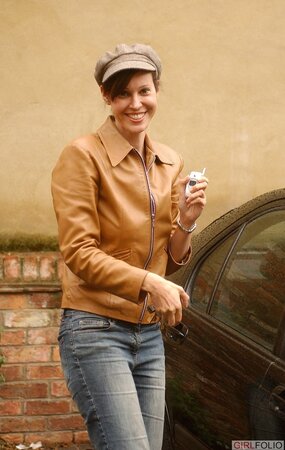 Playful brunette honey pulls off sexy underwear to expose big natural tits