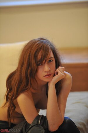 Flexible babe in leather pants is not shy to display every inch of her young body