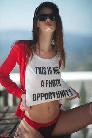 Tiny babe with sunglasses discards swimsuit and teases with her tits and pussy