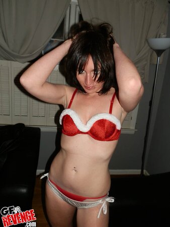 Amateur chick with sexy piercing takes down red lingerie and poses naked