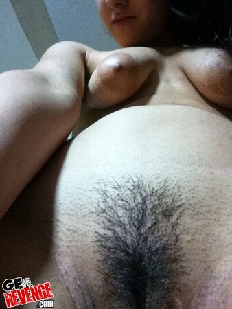 Big-assed amateur hottie plays with her trimmed pussy for the camera