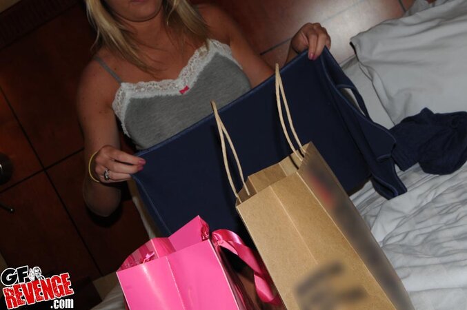 Hot blonde chick tries on new clothes showing off her round booty and big tits