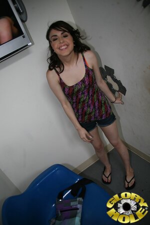 Pretty black-haired hussy sucks off three black peckers via gloryhole