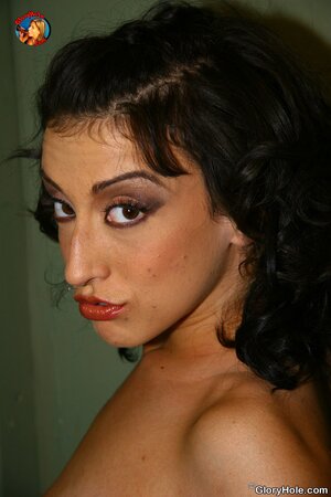 Black-haired bimbo masturbates before blowing black cock via gloryhole