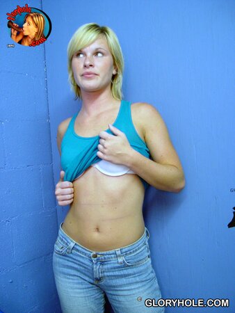 Pretty blond nympho masturbates and blows black pecker in a gloryhole room