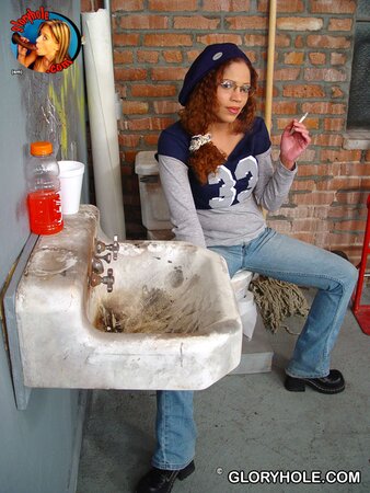 Nerdy minx receives cum on her pierced tongue after sucking dick through gloryhole