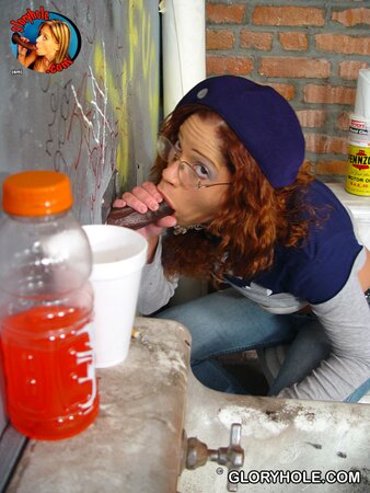 Nerdy minx receives cum on her pierced tongue after sucking dick through gloryhole
