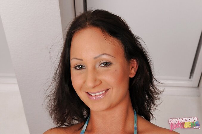 Playful brunette hussy undresses to demonstrate her tight cunny in a close up