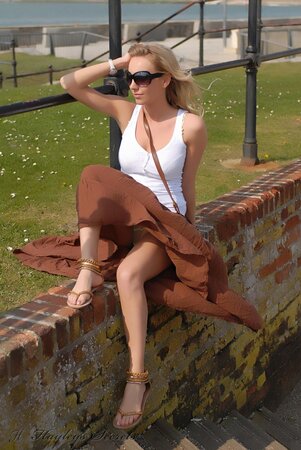 Totally shameless blonde flashing her tits and butt while taking a walk