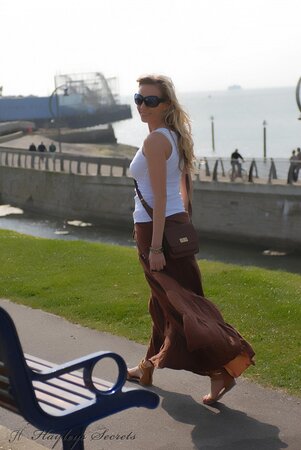 Totally shameless blonde flashing her tits and butt while taking a walk