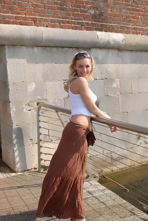 Totally shameless blonde flashing her tits and butt while taking a walk