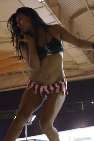 Tempting stripper flaunts her naked body while performing hot pole dance