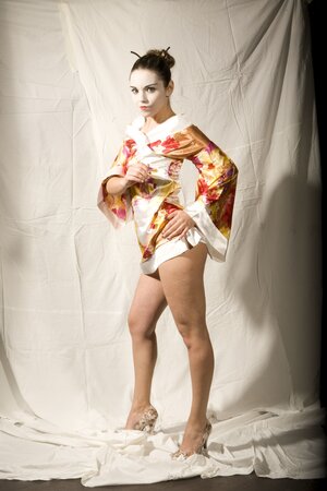 Lustful girl in Japanese geisha outfit reveals her tempting young curves