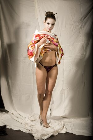 Lustful girl in Japanese geisha outfit reveals her tempting young curves