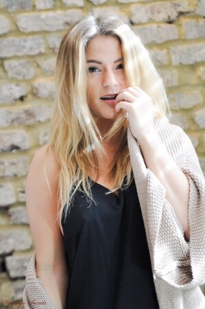 Adorable blond lassie doffs clothes to flaunt her big boobs and nice ass