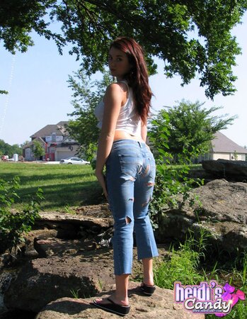 Pretty brunette cutie doesn’t hesitate to reveal her hot buns during casual walk
