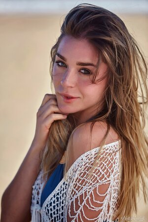 Sweet cutie teases by stripping and revealing perky boobs and coochie