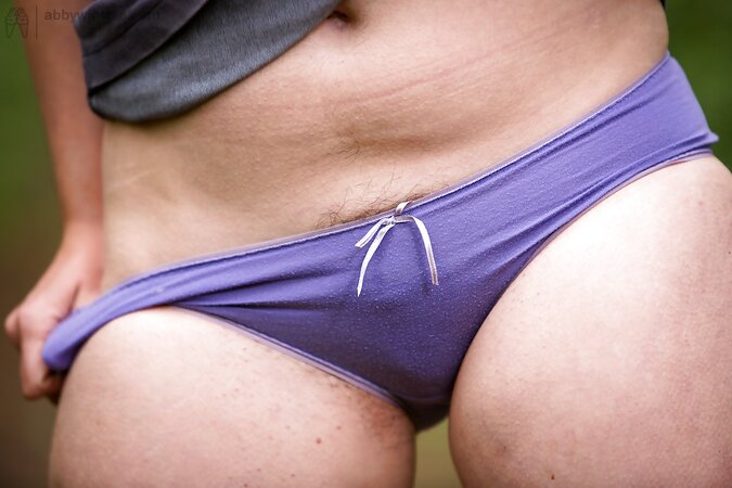 Skinny brunette is going to finger herself while outside