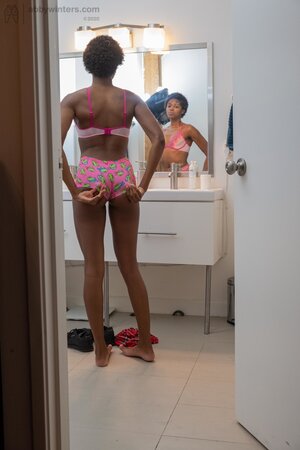 Small boobs ebony girl showing her long legs and teasing too