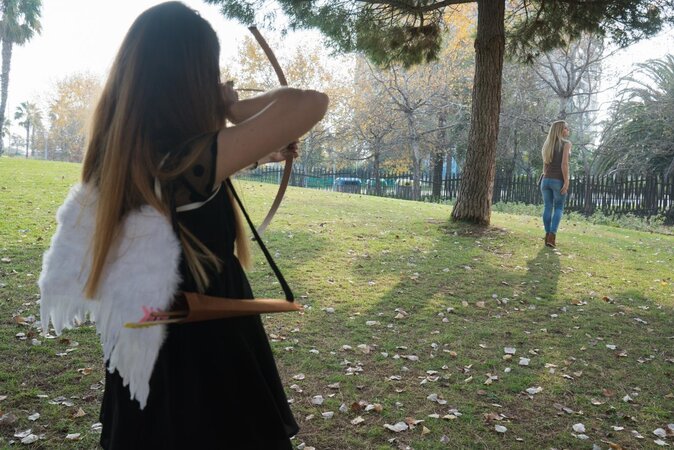 Two women use angel wings as a prop during lesbian fucking