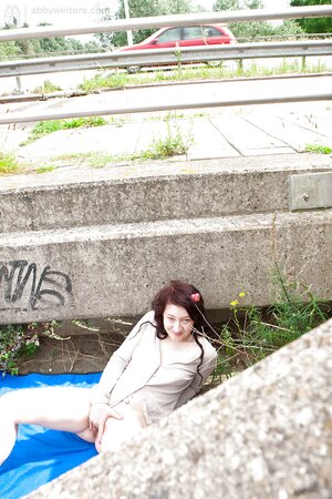 Well developed and sensual woman wearing a sexy outfit outside
