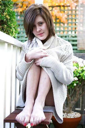 Brunette with a sexy smile showing her bush along the way