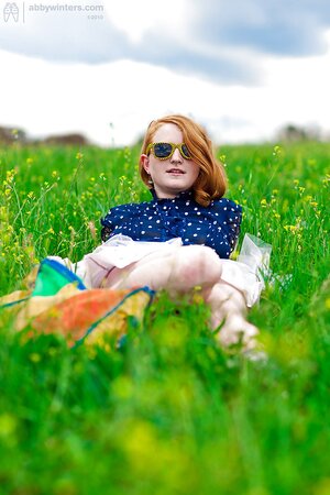Redheaded beauty in badass glasses is going to show her twat