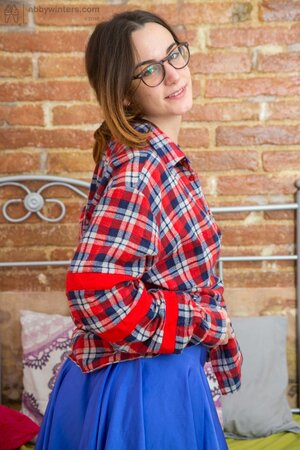 Adorable girl with a special brand of charm is showing her body
