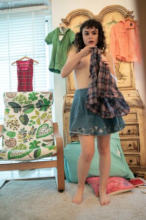 Adorable girl in a denim skirt is going to showcase her bush too