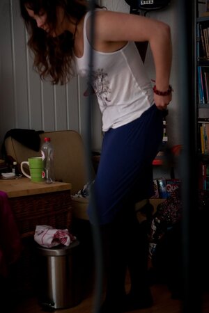 Brunette with natural breasts is going to show her backside too