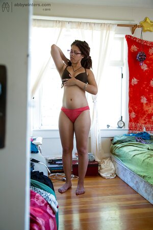 Geeky girl in glasses showing her meaty ass and teasing too