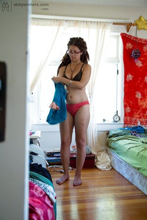 Geeky girl in glasses showing her meaty ass and teasing too