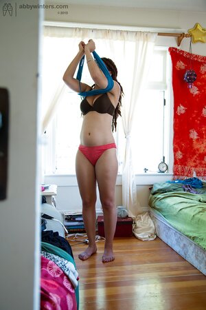 Geeky girl in glasses showing her meaty ass and teasing too
