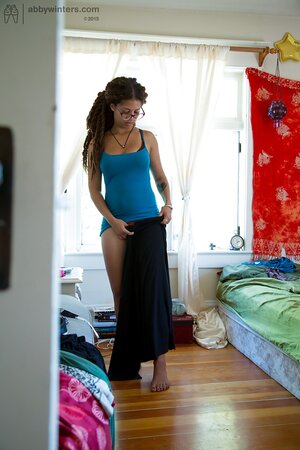 Geeky girl in glasses showing her meaty ass and teasing too