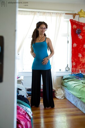 Geeky girl in glasses showing her meaty ass and teasing too