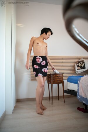 Short hair babe is showing her small boobs and long legs