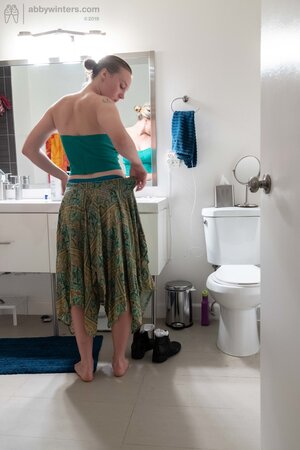 Blonde in a thong shows her backside while changing quickly