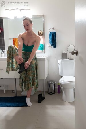 Blonde in a thong shows her backside while changing quickly